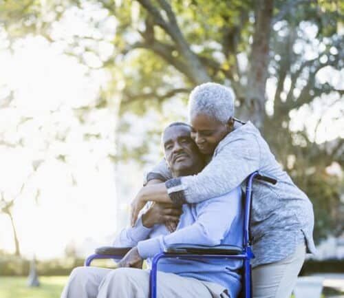 woman hugs stroke survivor