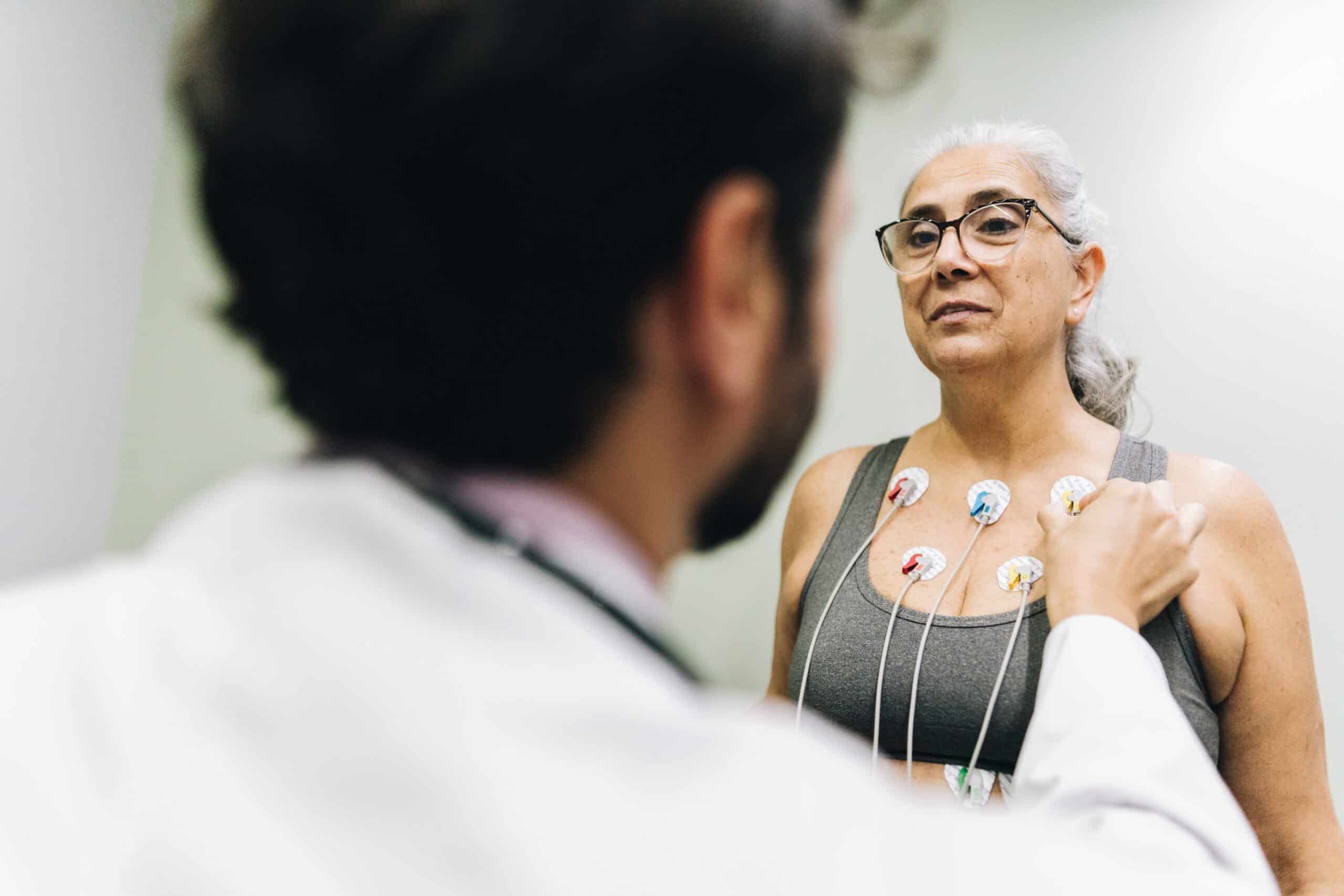 Patient talking with her doctor during a cardiopulmonary stress test on a hospital