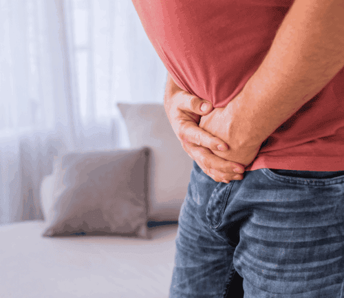 Man in pain from inguinal hernia