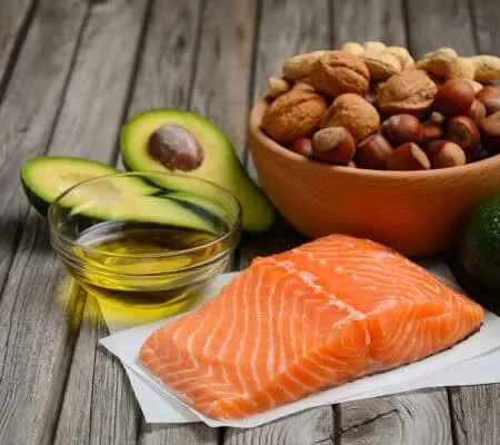 Selection of healthy fat sources. Rustic background.