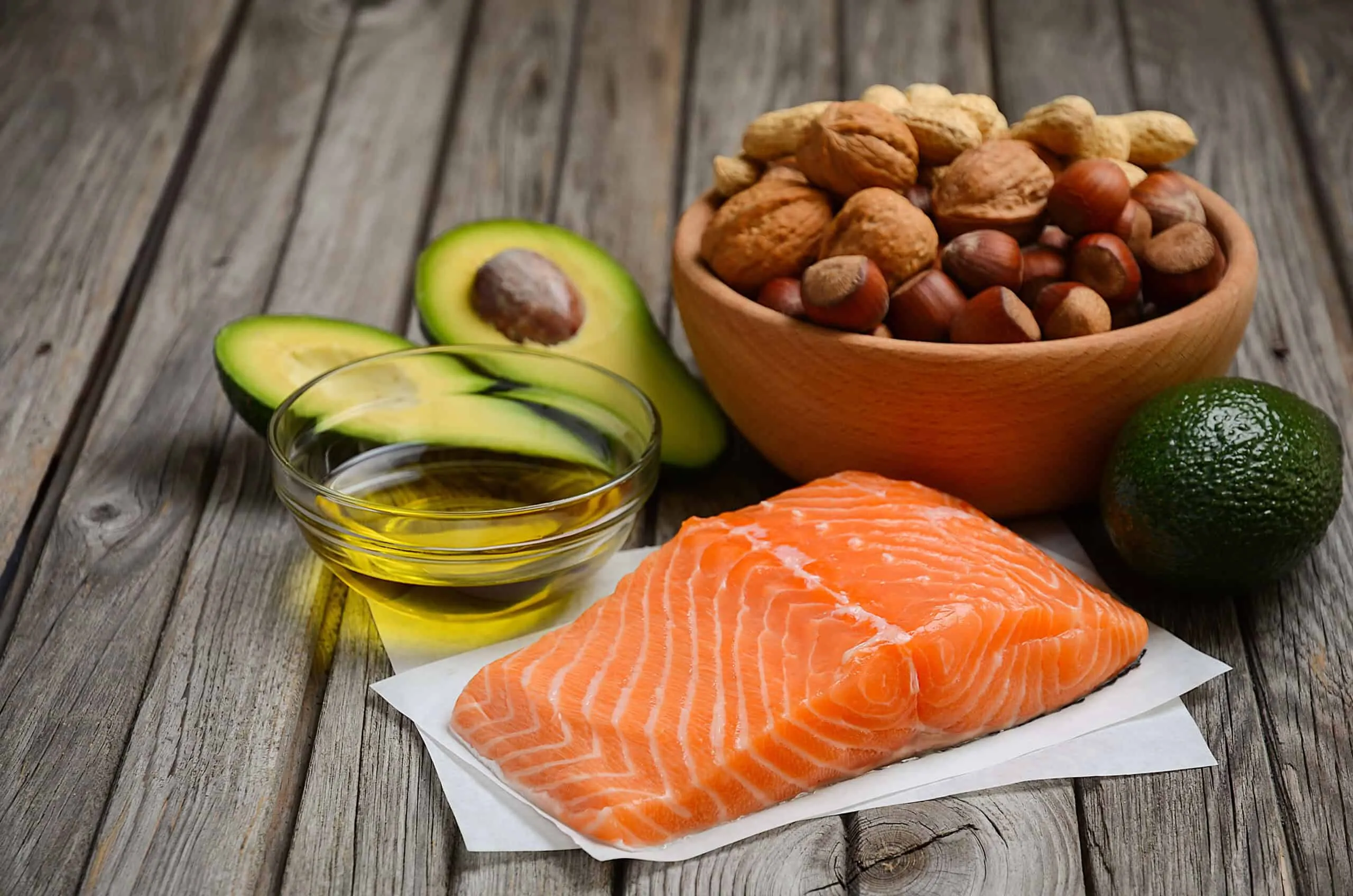 Selection of healthy fat sources. Rustic background.