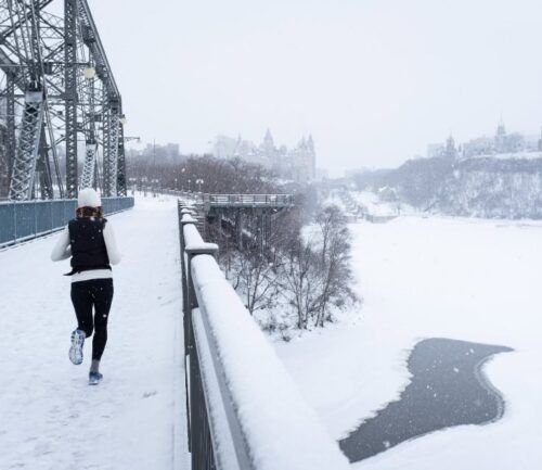 Female running outside in the cold