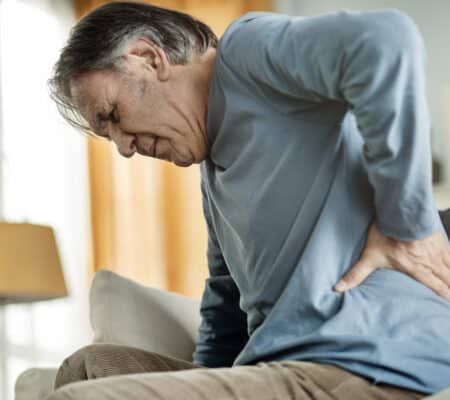 Old man suffering from kidney stone pain