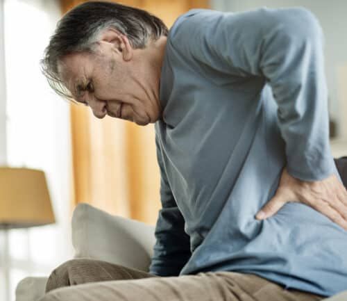 Old man suffering from kidney stone pain