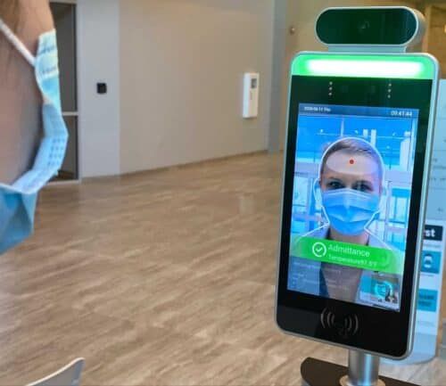 Woman has temperature scanned with ipad