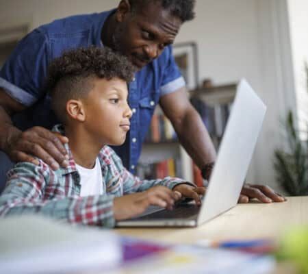 Father helping son with homework