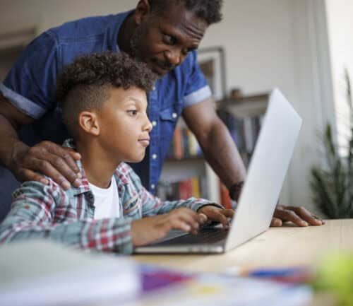 Father helping son with homework