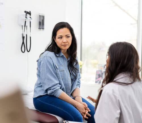 Woman becomes serious as unrecognizable female doctor gives advice