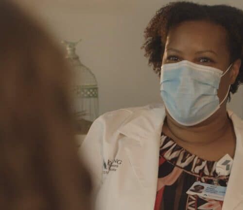 Kappi Hickman talking with a patient