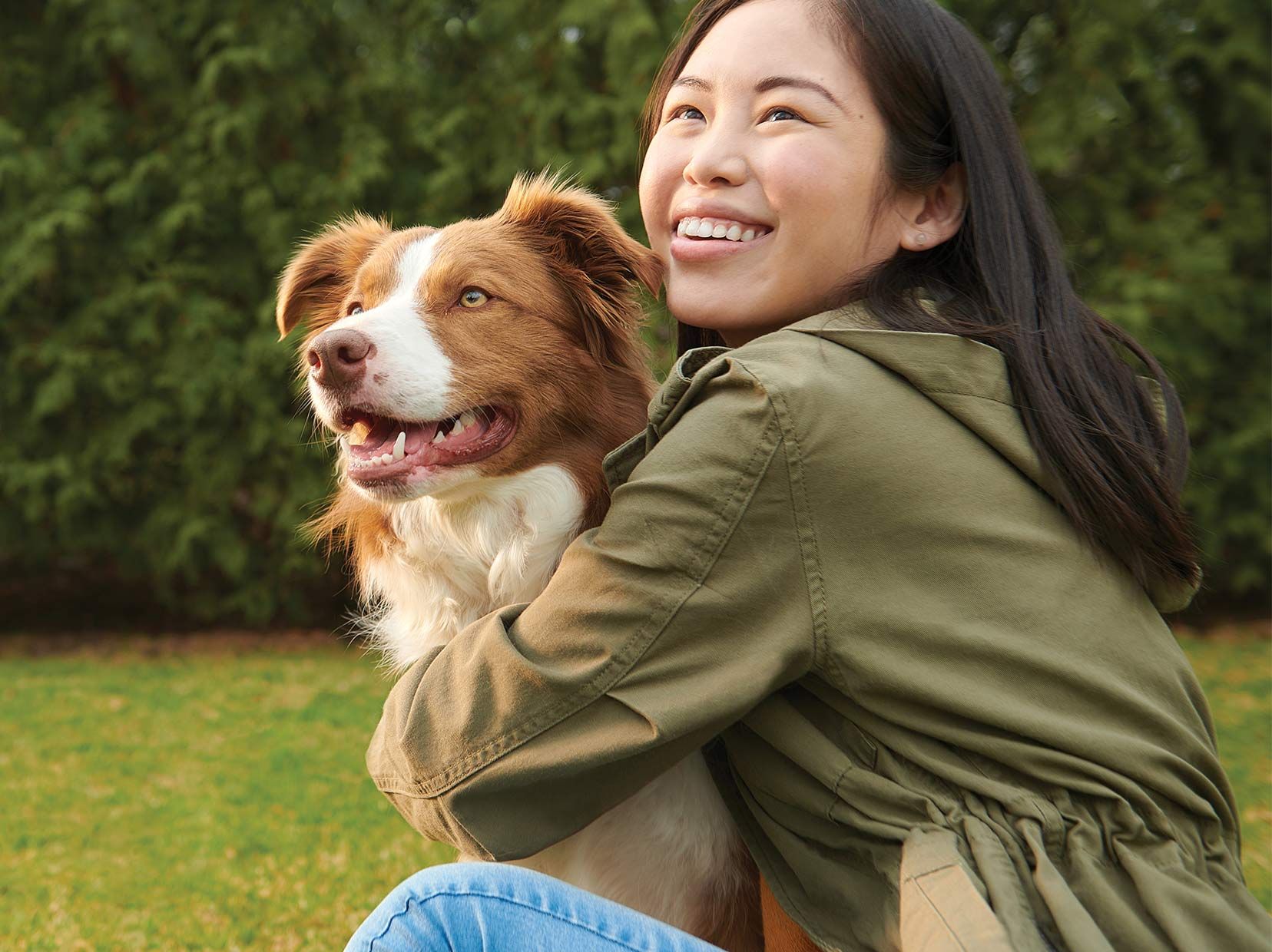 Woman and Dog Embracing