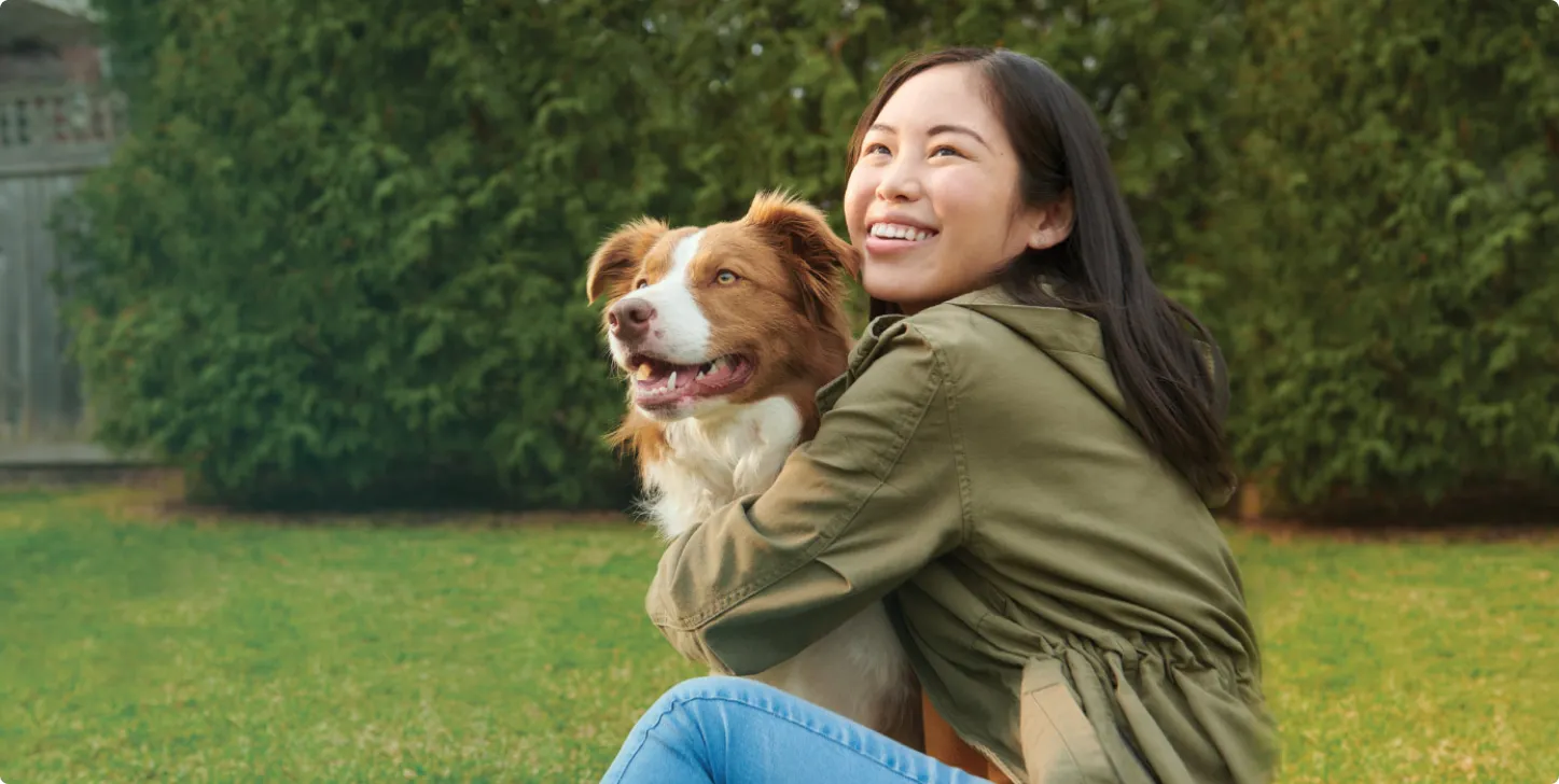 Woman and her dog playing outside – Kettering Health