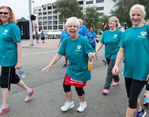 Women walking with water bottles.