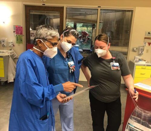 Dr. Shah speaking with nurses