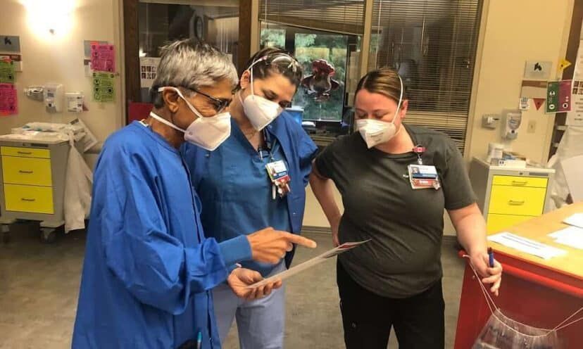 Dr. Shah speaking with nurses