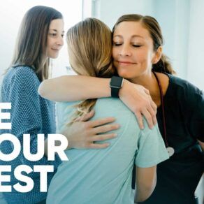 Patient receiving a hug from a nurse