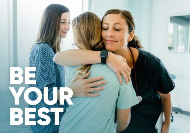 Patient receiving a hug from a nurse