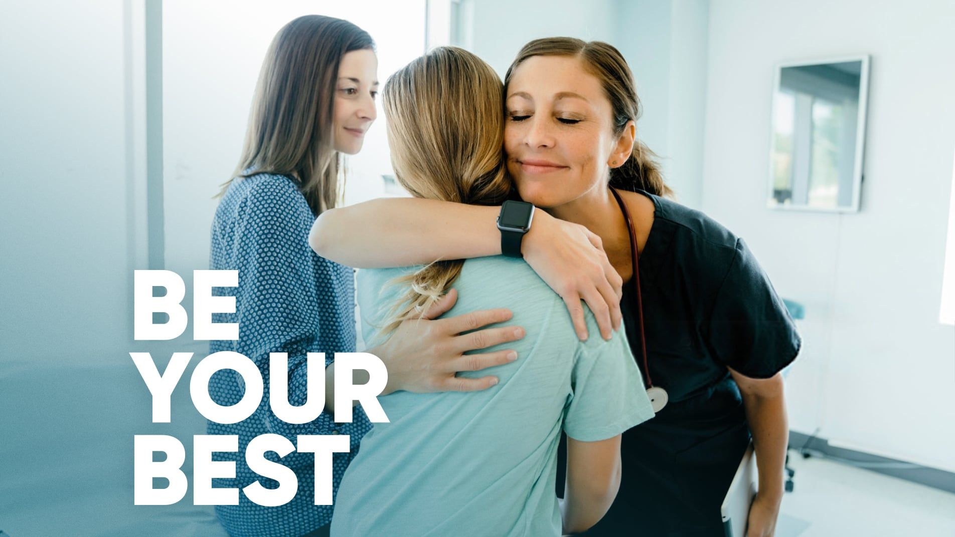 Patient receiving a hug from a nurse