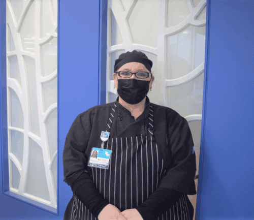 Jade Nohacs stands in front of wall at Kettering Health Miamisburg