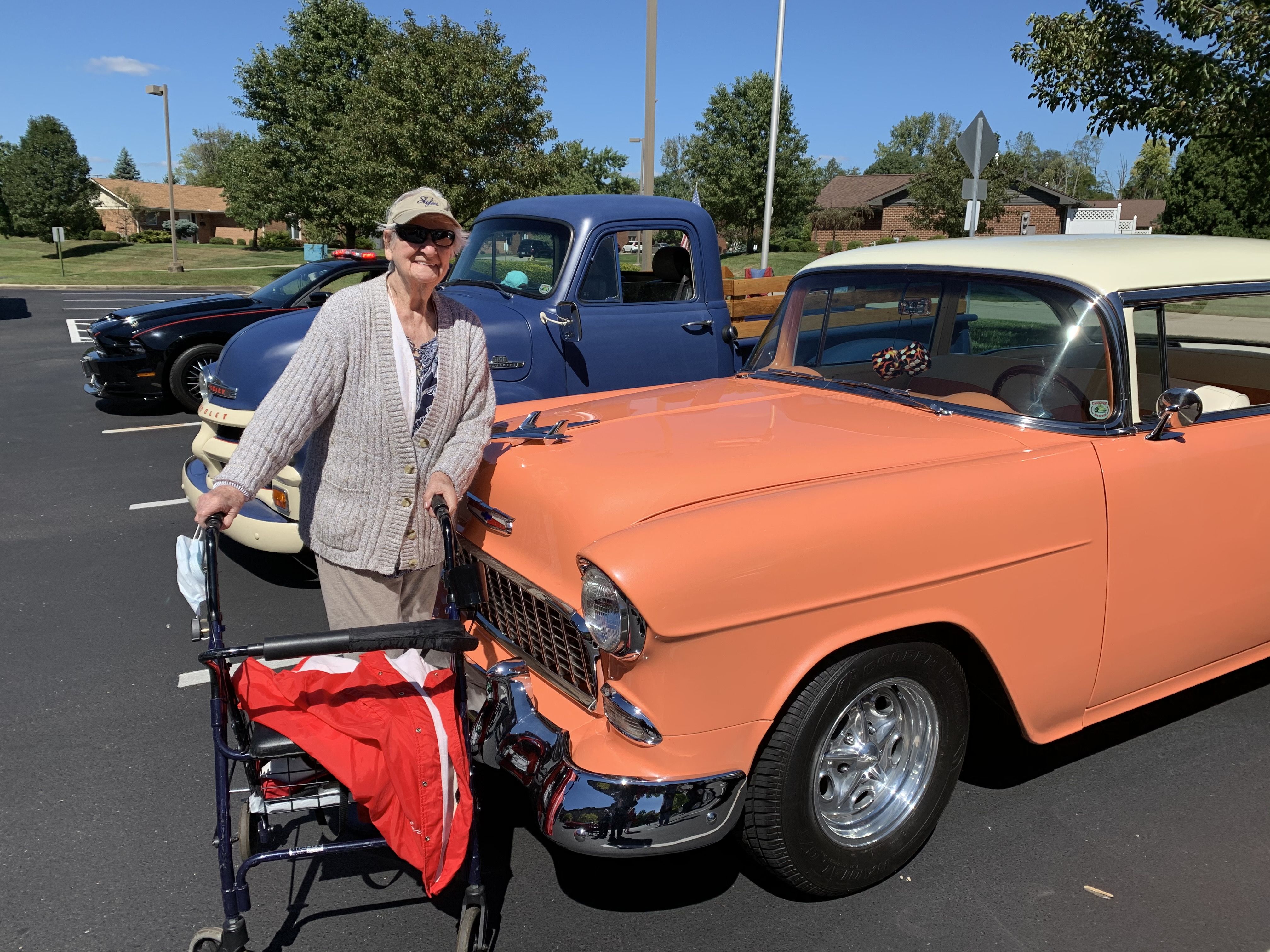 women with vintage car