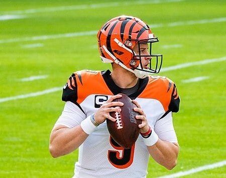 Joe Burrow, recently had appendicitis, throws a football