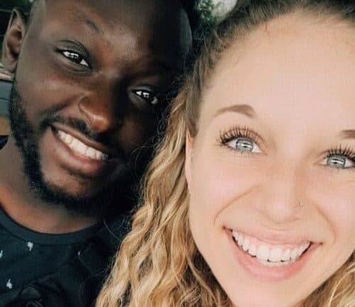 Gabby Wacker and her boyfriend smile into the camera