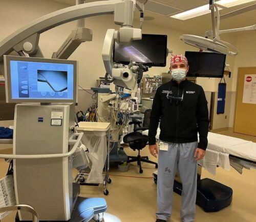 Dr. Markov looks into camera in operating room