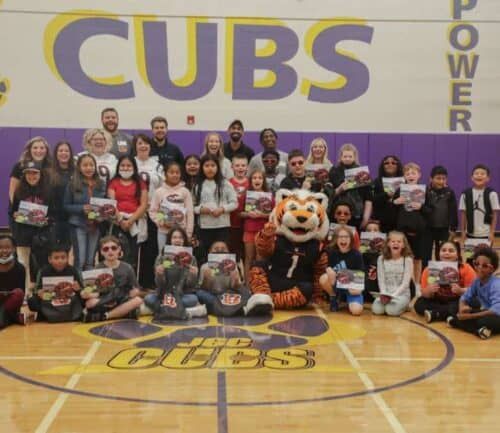 Who Dey Poses with school kids after gifting flag kits