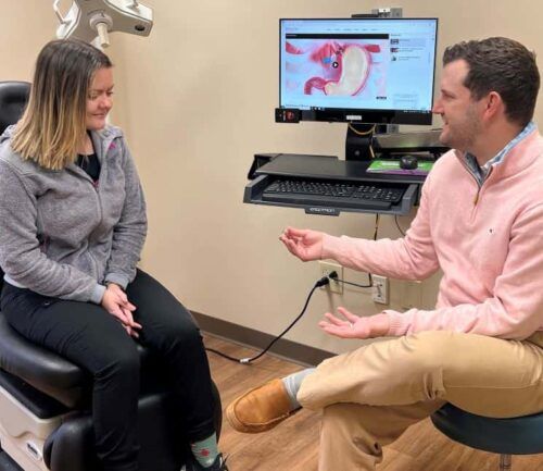 Dr. James Parker talking to patient about LINX