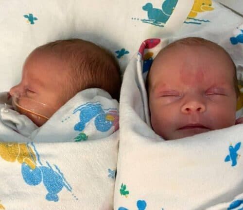 Heather Rainey's twin babies swaddled at the hospital