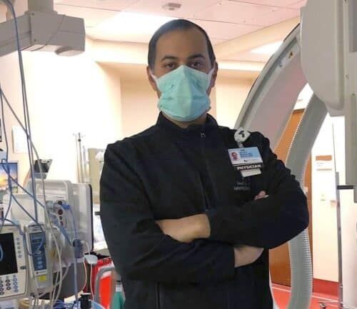 Dr. Bhirud poses in lab