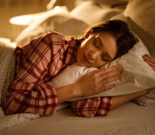 Woman sleeping in bed