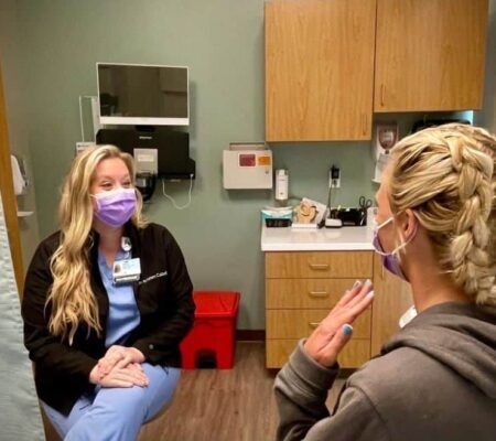 Dr. Caldwell OB-GYN talks to patient