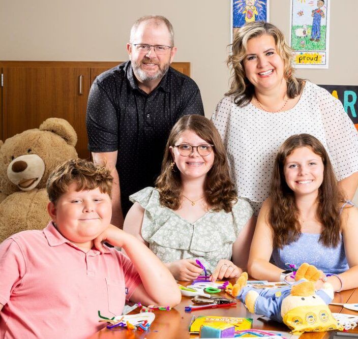 The Williamson family poses in the CLIMB program