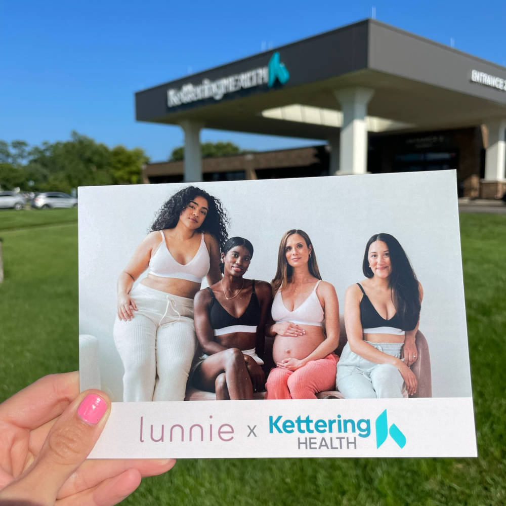 Woman in a photo in front of Kettering Health posing in Lunnie bras