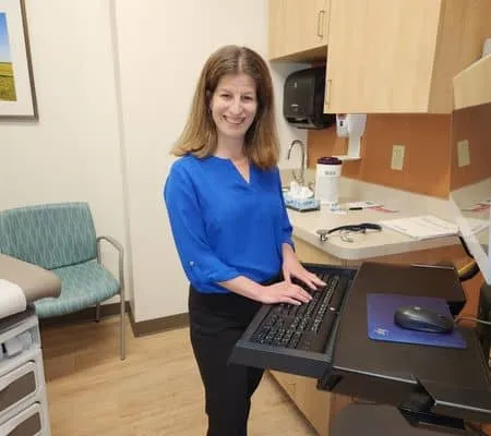 Dr. Keren Ray at computer in patient room