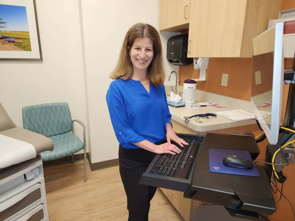 Dr. Keren Ray at computer in patient room