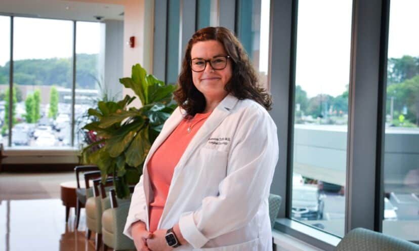 Dr. Rebecca Tuttle smiling in medical office