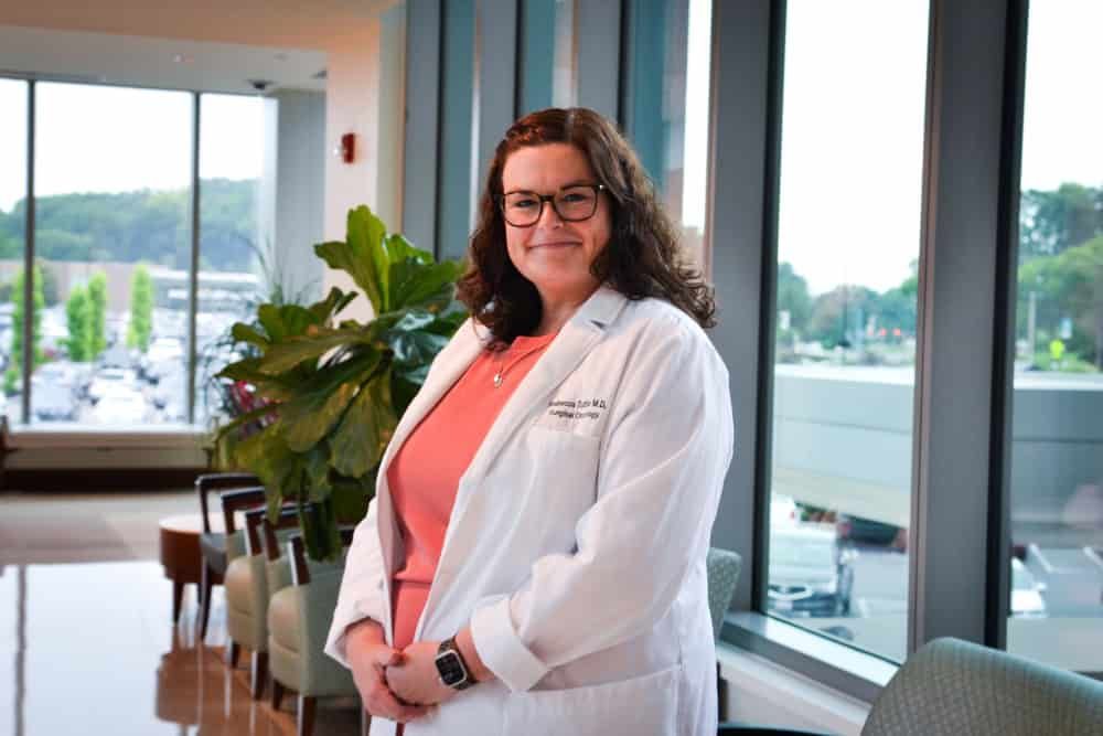 Dr. Rebecca Tuttle smiling in medical office