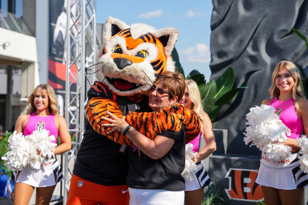 Who Dey hugs Hometown Hero DeAnn Gallatin