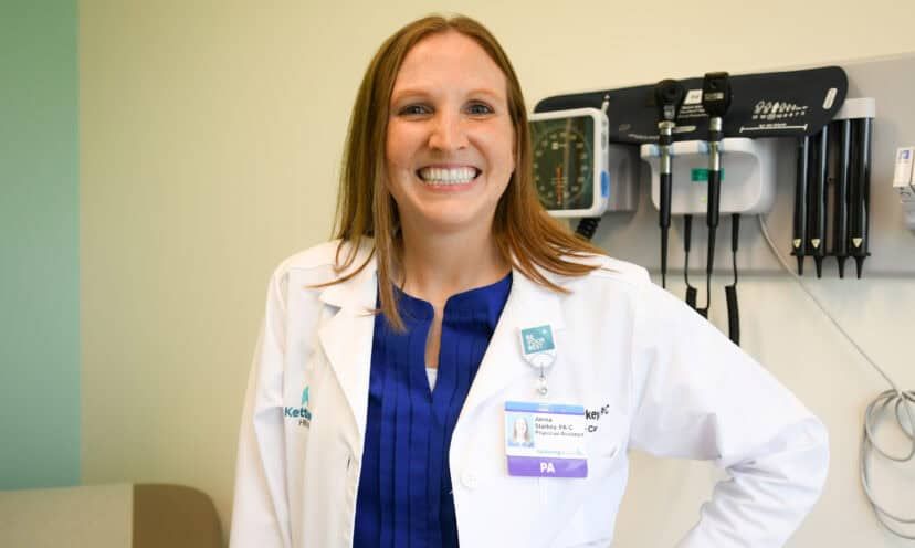 Janna Starkey smiling at camera in patient room