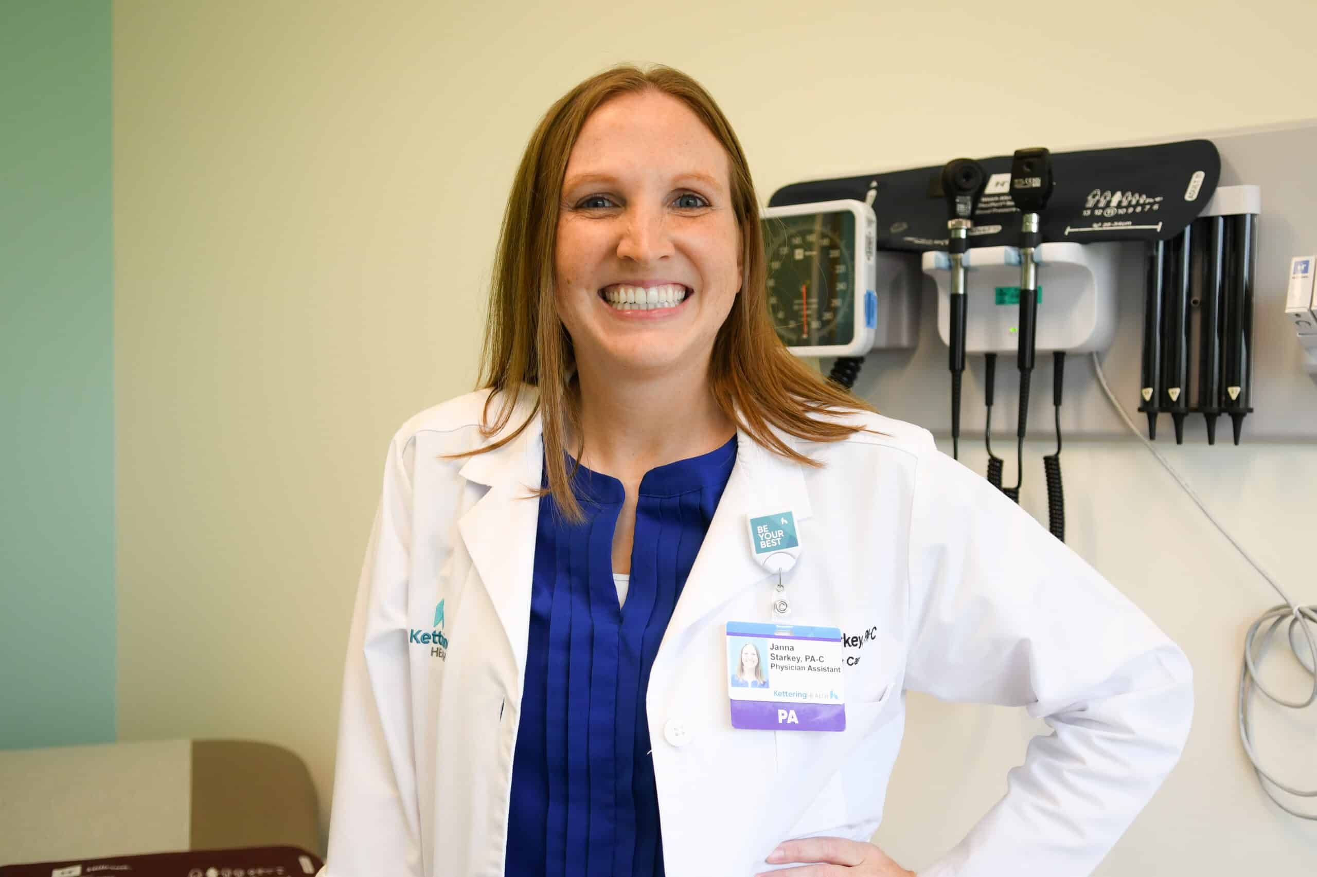 Janna Starkey smiling at camera in patient room