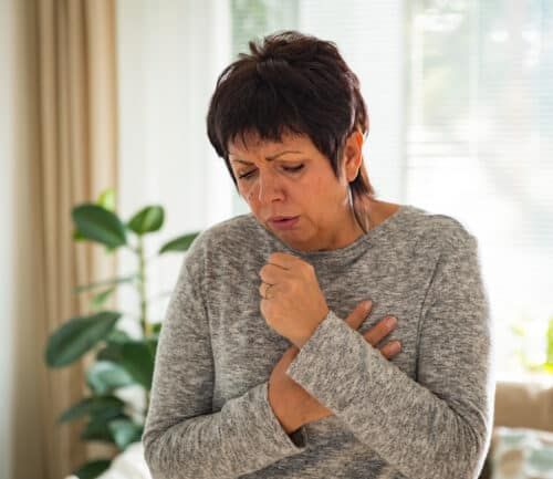Woman coughing