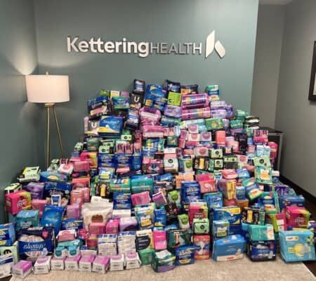 Boxes of period products stacked in a pile