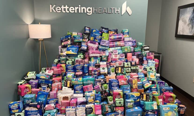 Boxes of period products stacked in a pile