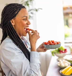 Woman eating fruits and vegetables