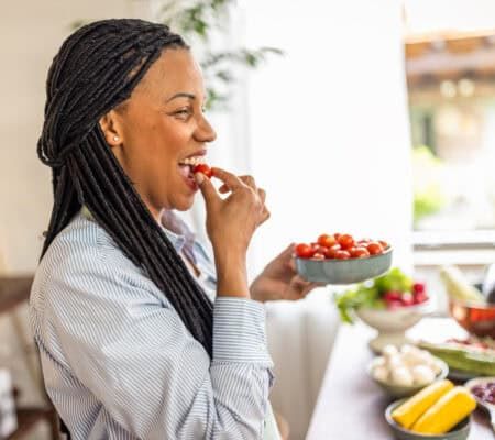 Woman eating fruits and vegetables