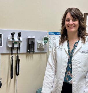 Doctor standing in patient room