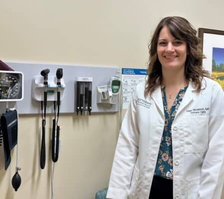 Doctor standing in patient room