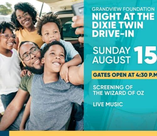 Happy family with children taking selfie in car at drive-in movie event