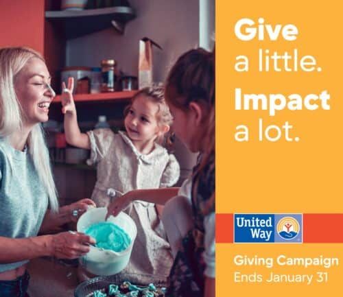 Mother and children baking together in kitchen, promoting United Way giving campaign.